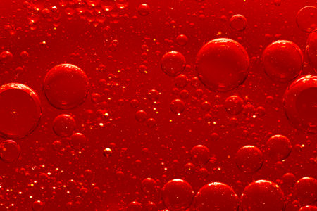 Water bubble texture on red backgroundの写真素材