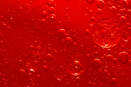 Water bubble texture on red backgroundの写真素材