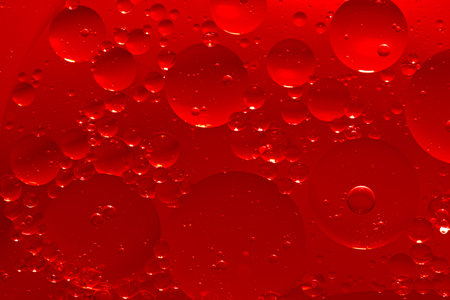 Water bubble texture on red backgroundの写真素材