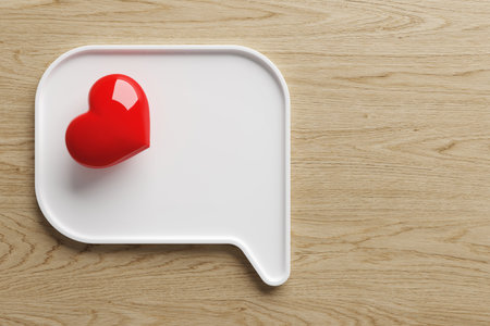 White ceramic plate text box text chat symbol shape 3d bright red heart on light wood background speech bubble balloon on top view. Dishes with love and health care. Copy space. 3D Illustration.の写真素材
