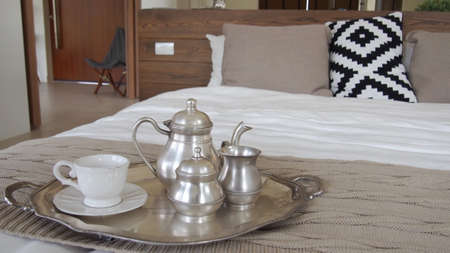 A tea set on the bedの写真素材