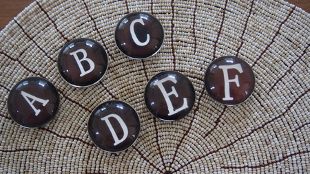 Alphabet A to F glass buttonの写真素材