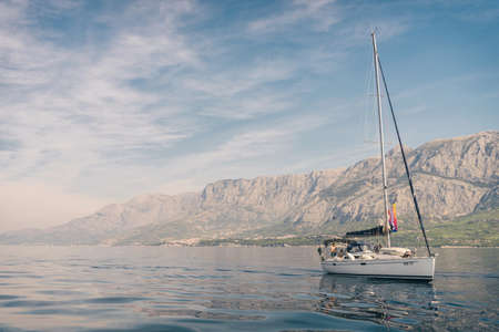 Sailing sunset on adriatic sea Makarska Korcula Croatia. Yacht in marina, sailing in Croatia.のeditorial素材