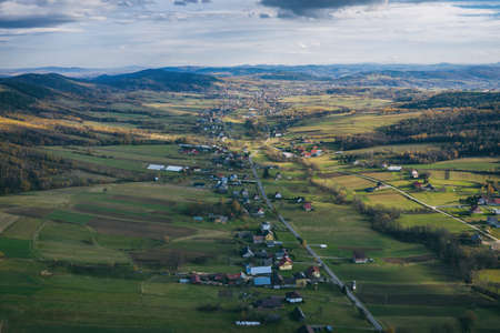Iwkowa village country in Brzesko Poland. Polish mountains and hills aerial drone photoの写真素材