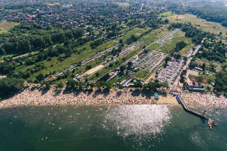 Holiday vacation on the sandy beach, sunbathing and swimming in the waterの写真素材