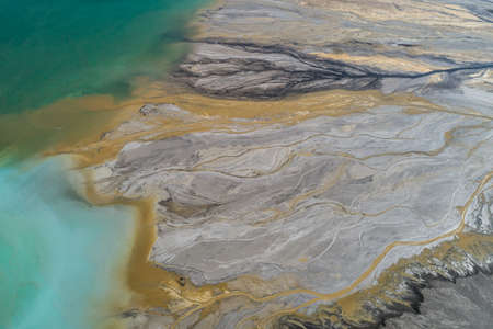 Industrial coal mine, abstract sendimentation tank of power plant , turquoise water like river deltaの写真素材