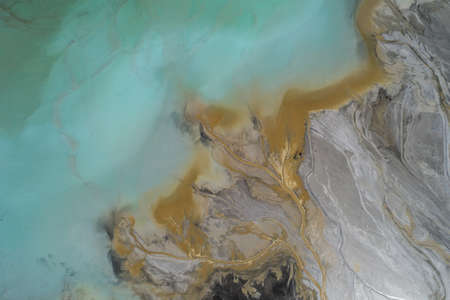 Industrial coal mine, abstract sendimentation tank of power plant , turquoise water like river deltaの写真素材