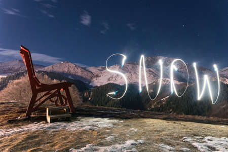 Big bench in Prato nevoso resort at night in Piedmont Alps mountais Italyの写真素材