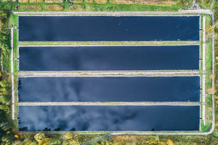 Abstract sendimentation tank of ironworks water treatment plant in Silesia Poland aerial drone photo...