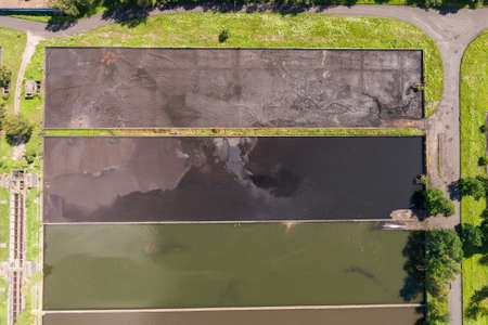 Abstract sendimentation tank of ironworks water treatment plant in Dabrowa Gornicza Silesia Poland aerial drone photo viewの写真素材