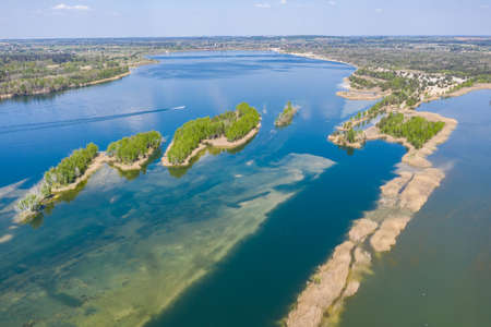 Beautiful lake with sand islands like atol. Lake pogoria in Dabrowa Gornicza Poland aerial drone...