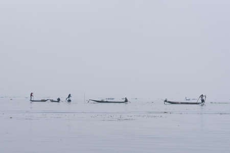 Traditional fisherman on a boat on Inle Lake Myanmar Burma in Asiaの写真素材