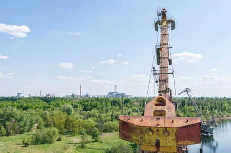 Abandoned dock cranes in Prypiat, Chernobyl exclusion Zone. Chernobyl Nuclear Power Plant Zone of Alienation in Ukraine Soviet Unionの写真素材
