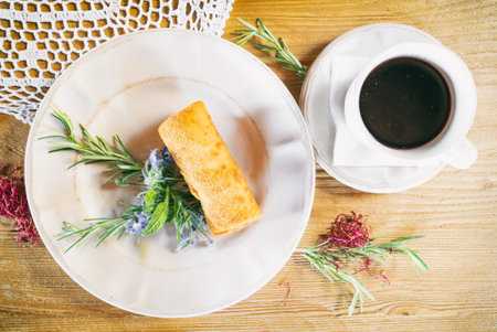 Red borscht with dumplings or a croquette on a plante. Dinner soup on a wooden table. Traditional polish famous cuisineの写真素材