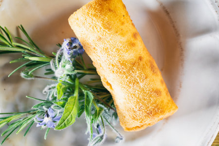 Red borscht with dumplings or a croquette on a plante. Dinner soup on a wooden table. Traditional polish famous cuisineの写真素材