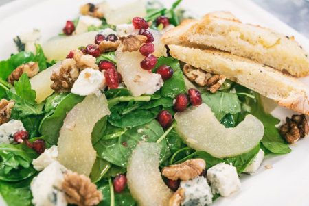 Pear Salad with Dried Cherries, Candied Walnuts and gorgonzola cheese. Caramelized pear salad with Walnutsの写真素材