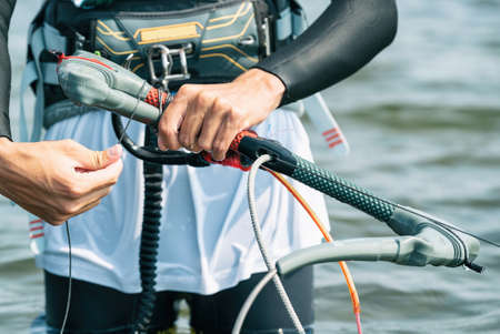Kiteboard or kitesurfing kitebar. Summer sport learning how to kitesurf. Kite surfing on Puck bay in...