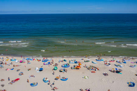 Sunbathing on the beach by the sea. Aerial drone photo view of Baltic Sea coast in Hel peninsula, Jastarnia. Puck Bay in Polandのeditorial素材