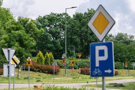 Street with road Signs and Traffic Symbols in Poland. Bicycle square sign learning area in Polandの写真素材