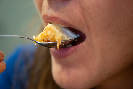 Woman eats food. Woman eats cheesecake. Close shot of girl eating cake. Face while eating cake.