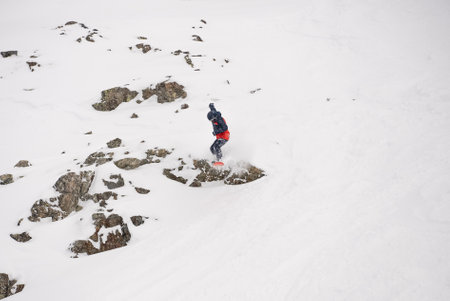 Freeride powder, snowboarding in Les deux alpes resort in winter, mountains in French alps, Rhone Alpes in France Europe. Fresh powder freeride.の写真素材
