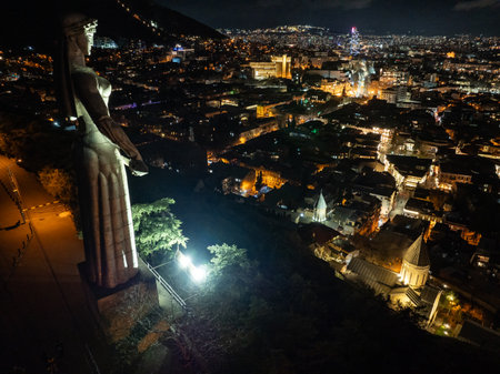 Aerial drone night photo of Tbilisi. Mother of Georgia in Sololaki hill Georgia Aerial drone view....