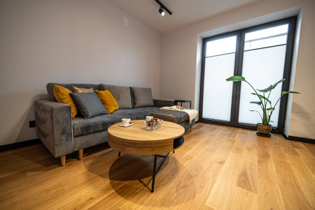 The Chic and Cozy Interior of a Modern Living Room Featuring a Stylish Sofa and Sleek Coffee Table....