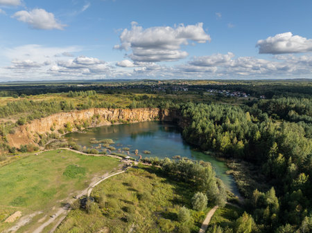 Aerial drone photo of Quarry turquiose lake colour, open pit mining in Park Grodek, Jaworzno. Poland. Turquiose Water and Wooden Bridge. Polish Maldives Park Grodek in Jaworzno from drone.の写真素材