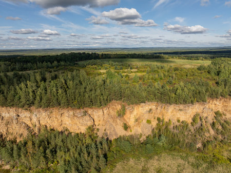 Aerial drone photo of turquoise lake colour, open pit mining in Park Grodek, Jaworzno. Poland. Turquoise Water and Wooden Bridge. Park Grodek in Jaworzno from drone.の写真素材