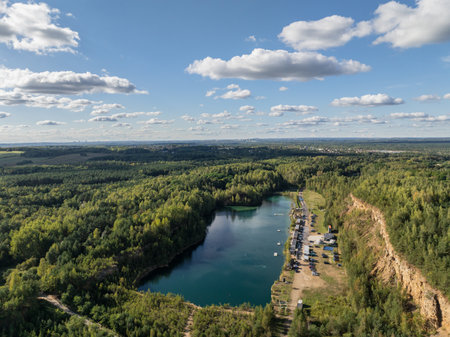 Aerial drone photo of Quarry turquiose lake colour, open pit mining in Park Grodek, Jaworzno. Poland. Turquiose Water and Wooden Bridge. Polish Maldives Park Grodek in Jaworzno from drone.の写真素材