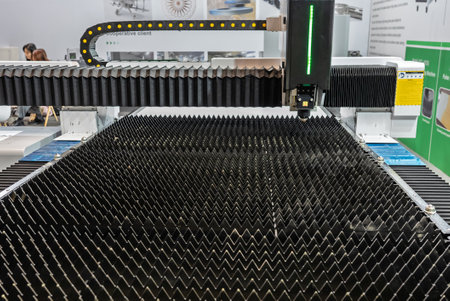 Cnc laser machining center. Laser cutting center. CNC laser metal processing. Laser cutting machine.