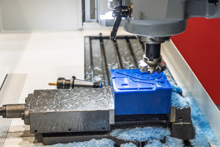Metalworking CNC lathe milling machine with coolant. Milling a piece of plastic. Industrial...
