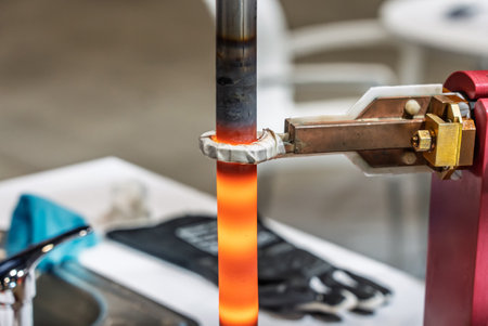Induction hardening type of surface hardening. Metal part is induction-heated and then quenched....
