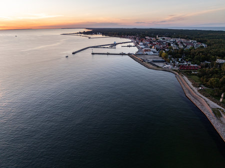 Aerial view of Hel Peninsula in Poland, Baltic Sea and Puck Bay. Aerial video made by drone from above. End of poland hel peninsula. Hel beach in Poland. Sunset at sea and bay, Poland.の写真素材