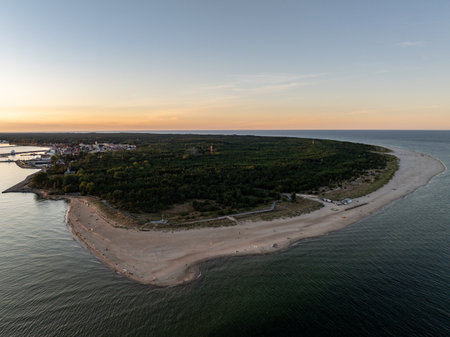Hel city. Aerial view of Hel Peninsula in Poland, Baltic Sea and Puck Bay. Aerial video made by drone from above. End of poland hel peninsula. Hel beach in Poland. Sunset at sea and bay, Poland.の写真素材