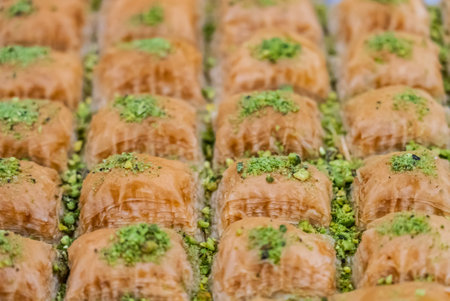 Baclava layered pastry dessert made of filo pastry, filled with chopped nuts, and sweetened with syrup or honey. Baclava or pakhlava the sweet pastries of Ottoman, Arabian, Persian and Greek cuisine.の写真素材