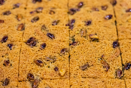 Baclava layered pastry dessert made of filo pastry, filled with chopped nuts, and sweetened with syrup or honey. Baclava or pakhlava the sweet pastries of Ottoman, Arabian, Persian and Greek cuisine.の写真素材