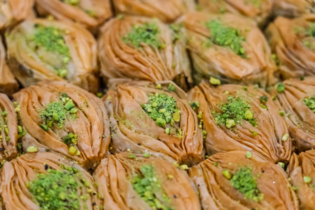 Baclava layered pastry dessert made of filo pastry, filled with chopped nuts, and sweetened with syrup or honey. Baclava or pakhlava the sweet pastries of Ottoman, Arabian, Persian and Greek cuisine.の写真素材