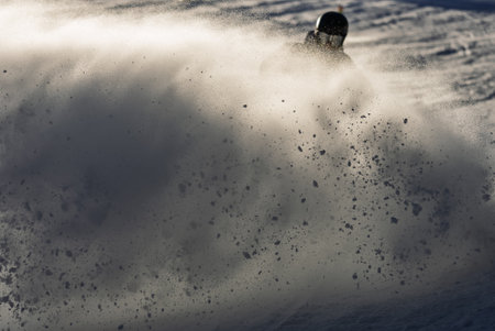 Group of people skiing in the mountains on a sunny winter day. Ski lessons with local instructors. Children learn to ski with an instructor. Children's skiers in the Alps.の写真素材