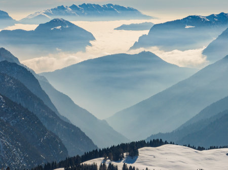 Aerial drone view of sunny winter in dolomites, alps. Pinzolo village and a ski resort in Italy. Dolomites Brenta, Adamello park Presanella moutain, Doss del Sabion skiarea trentino Italy.の写真素材