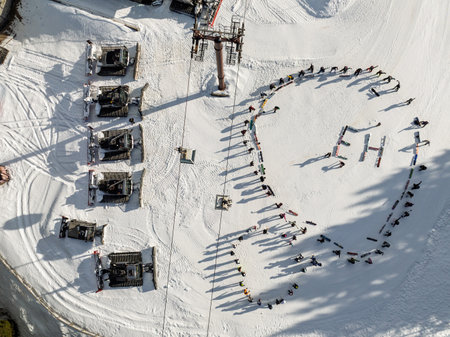 Winter warm up on snow in mountains. Aerial drone view of warm up in sunny winter in dolomites, alps. Warm up before ski snowboard riding. Pinzolo in Val Rendena dolomites trentino Italy.の写真素材