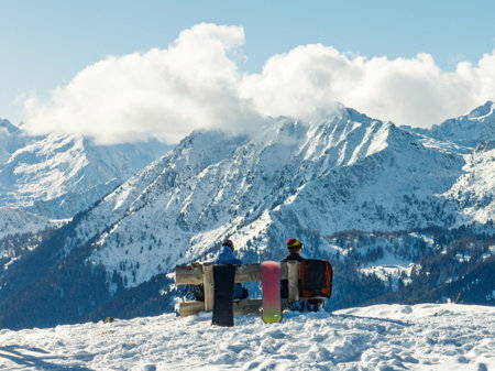 Aerial drone view of sunny winter. Aerial drone view of person on top of mountain with snowboard, mountain view in sunny winter day.の写真素材