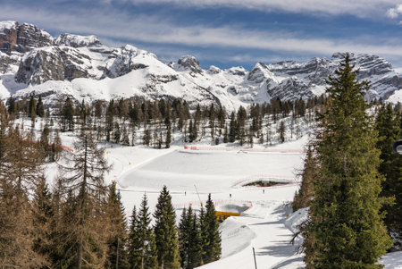 View of sunny winter in dolomites, alps. Pinzolo village and a ski resort in Italy. Dolomites Brenta, Adamello park Presanella moutain, Doss del Sabion skiarea trentino Italy.の写真素材