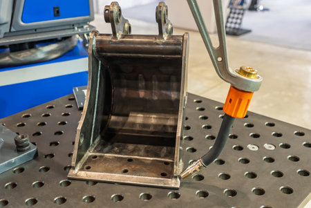 Robot welds steel. Welding head. CNC welding. Robotization and automation of the weld process. Robot...