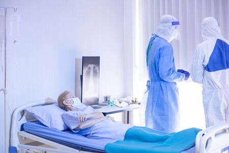 Old Female patients despaired in hospital beds After being infected with coronavirus - covid19. The...