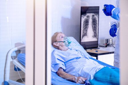 Doctor and nurse with Infected patient x-ray Lung in quarantine room at hospital case from...