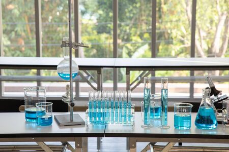 laboratory area for Scientists trying to find vaccine covid19 to defeat the coronavirus. Many scient equipment such as tube and microscope in lab for research.の写真素材