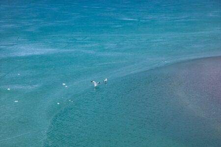 Blue Ice surface of Frozen Lake from drone aerial view at Pangong Lake or Pangong Tso, Tso moriri â Nubra, India. Abstract concept of Cold winter, peaceful and freedom.の写真素材