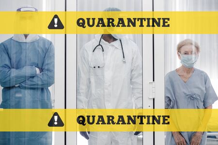 Old patient has been infected on coronavirus covid19 contagious disease and state quarantine in the quarantine room in hospital with under take care of medical team.の写真素材