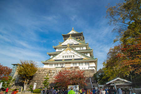 Osaka castle tower in japan, in Autumn, maple leaf colour change, very beautiful design on architectureのeditorial素材